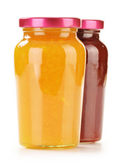 Two jars of fruity jams isolated on white. Preserved fruits