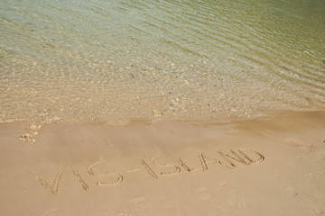 Vis island word in the sand at the beach