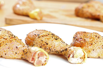 Chicken legs on white plate