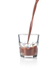 Filling glass of chocolate milkshake