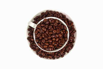 cup with beans coffee on saucer