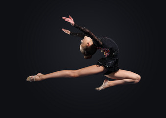 Young woman in gymnast suit posing