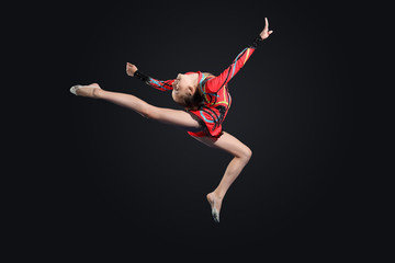 Fototapeta premium Young woman in gymnast suit posing