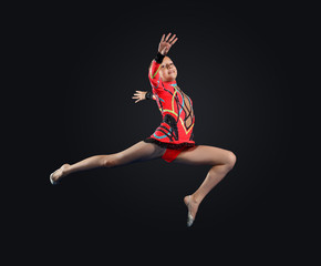 Naklejka premium Young woman in gymnast suit posing