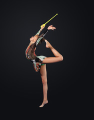 Obraz na płótnie Canvas Young woman in gymnast suit posing