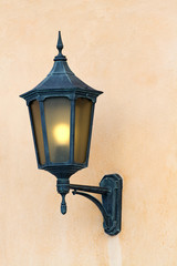 Vintage lantern on a wall.