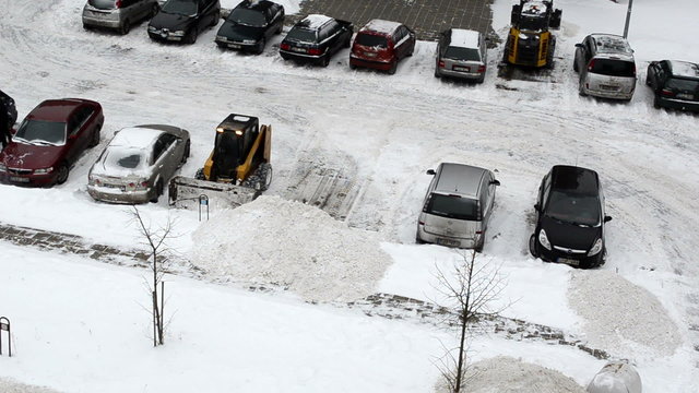 small tractors clean winter snow block flat house parking-lot