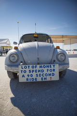Sign about money displayed on a vintage car