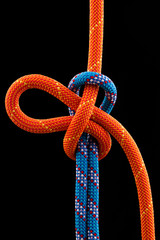 Naklejka premium rope knot isolated on black background