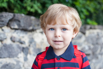 Little toddler boy on way to kindergarten