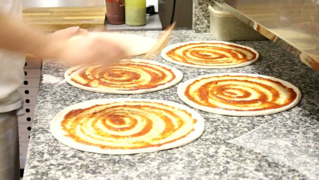 Pizza making in a pizzeria