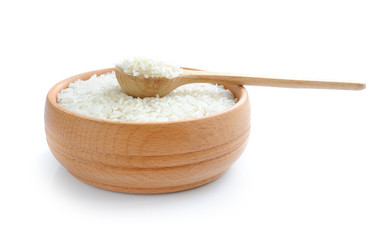 Rice in wooden bowl and spoon isolated on white background