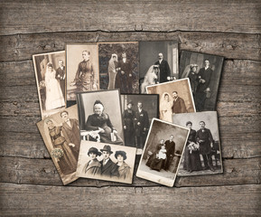 vintage family photos on wooden background