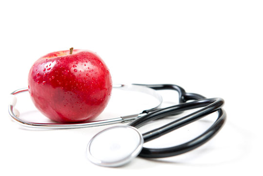 Stethoscope and a red apple