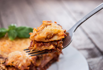Piece of fresh made Lasagne on a fork