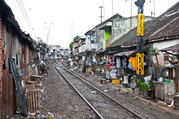 Wandcirkels aluminium Unidentified poor people living in slum, Indonesia. © Aleksandar Todorovic
