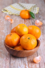 Fresh mandarins on the wooden table