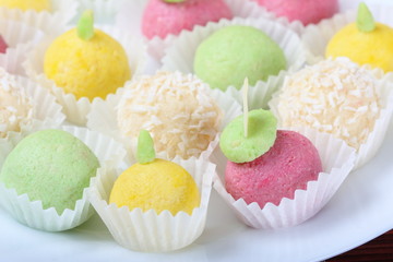 Colorful candy on a white plate