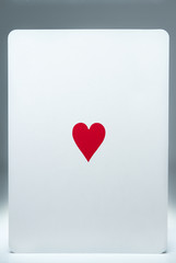 Balancing card with heart symbol