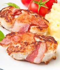 grilled chicken patties wrapped strips of bacon and mashed potat