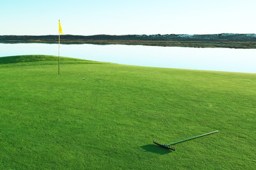 Obraz premium Green glade golf course, and rake the sand.