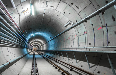 Underground tunnel with blue lights - obrazy, fototapety, plakaty