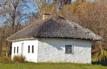 Ancient traditional ukrainian rural cottage with a straw roof