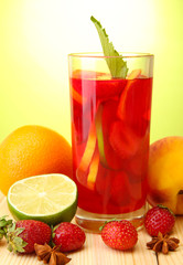 Refreshing sangria in glass with fruits,