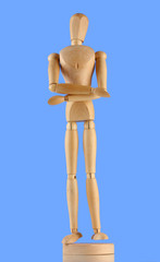 wooden mannequin, on blue background