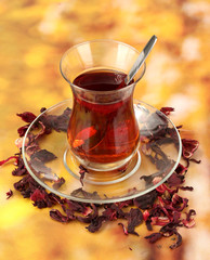 glass of Turkish tea on color background