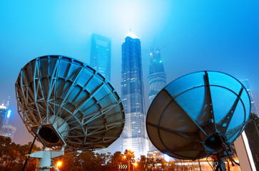 Shanghai's skyscrapers and satellite antenna.