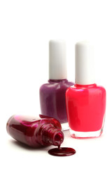 open bottles with bright nail polish isolated on white