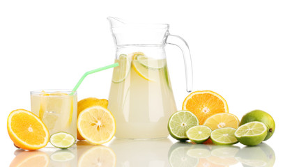 Citrus lemonade in pitcher and glass of citrus around isolated