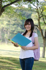 Fototapeta premium asian college girl studying outdoor