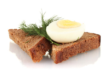 Boiled egg  on dark bread isolated on white