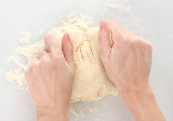 Fototapeta premium Preparing pizza dough isolated on white