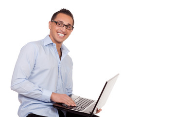 Enthusiastic businessman using a laptop