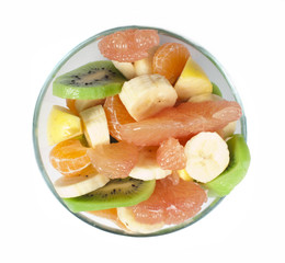 Fruit salad with citrus in a glass bowl