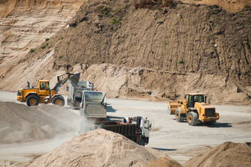 Machines working at gravel pit