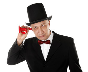 Rich man is listening in something with ear trumpet