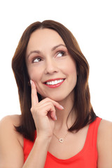 Fototapeta premium Woman thinking with finger on chin