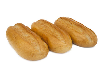 Three loaves of white bread on a white background