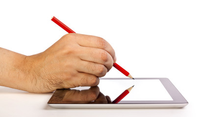 Hand writing on a tablet with a pencil