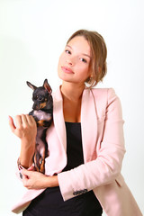 Seductive young woman with Chihuahua isolated on white backgroun