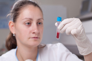 Holding test tube full of blood