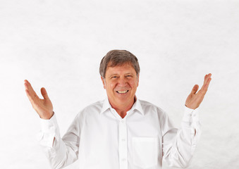 happy senior man standing gesturing against white background