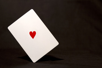 Balanced white card with heart symbol