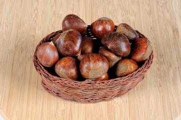 Chestnuts in wicker basket © Arena Photo UK