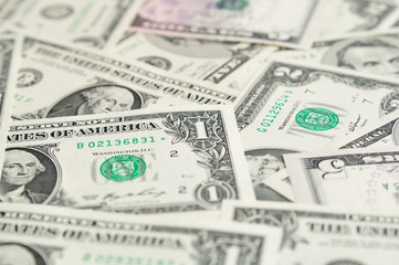 Fototapeta premium Dollar banknotes as background with selective focus.