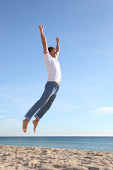 Man jumping happy in the beach